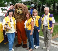some Lions beside their entry in the parade