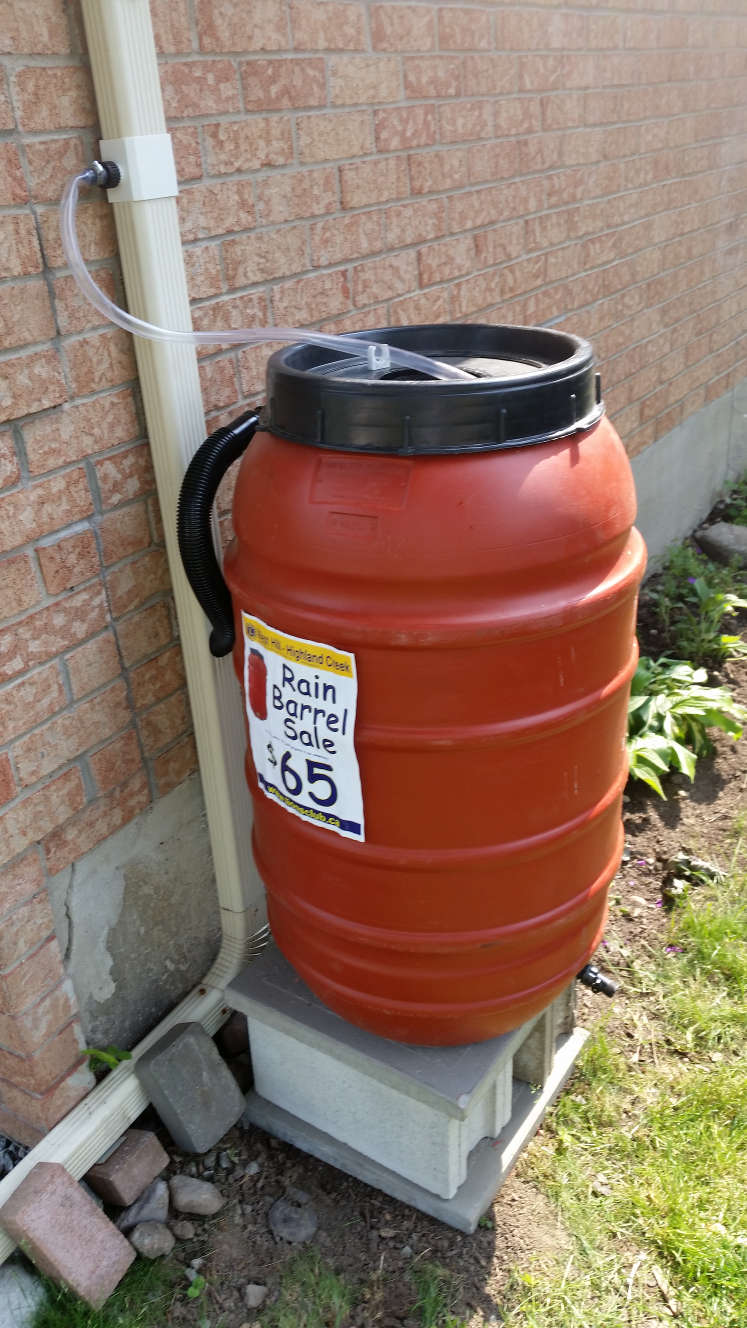  rain barrel on concrete block base